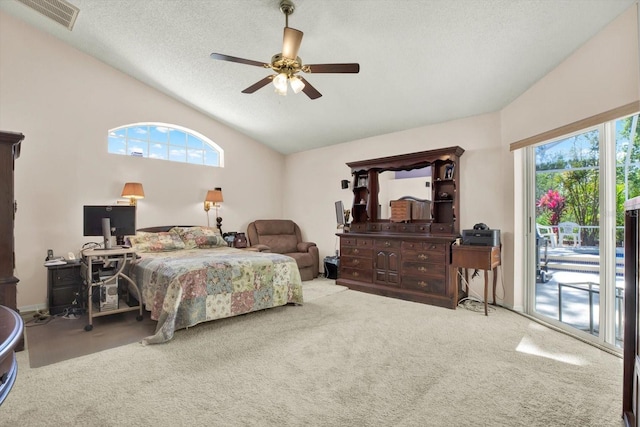 bedroom with access to exterior, visible vents, vaulted ceiling, and multiple windows