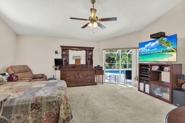 bedroom featuring a textured ceiling, carpet flooring, lofted ceiling, and access to outside