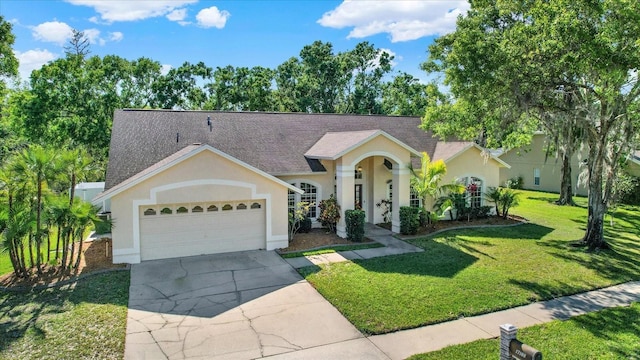 ranch-style home featuring stucco siding, roof with shingles, driveway, a front yard, and a garage