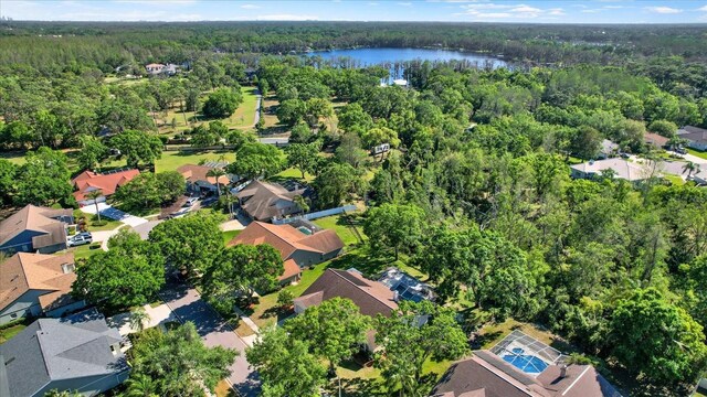 aerial view with a water view, a forest view, and a residential view