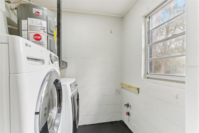 7711 Amherst St Unit A & B, Tampa, FL 33625 - laundry area with concrete block wall, washing machine and dryer, and water heater