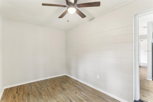 7711 Amherst St Unit A & B, Tampa, FL 33625 - empty room with wood finished floors, baseboards, and a ceiling fan