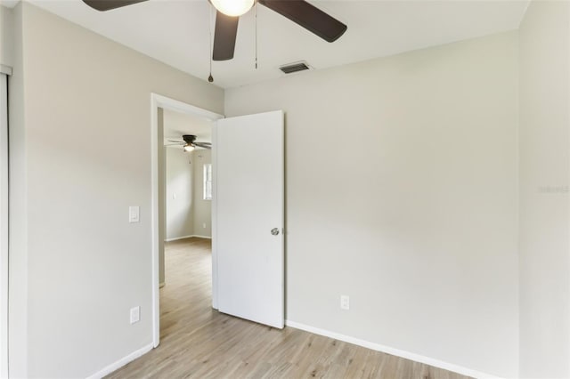 7711 Amherst St Unit A & B, Tampa, FL 33625 - unfurnished room featuring a ceiling fan, light wood-style floors, and baseboards
