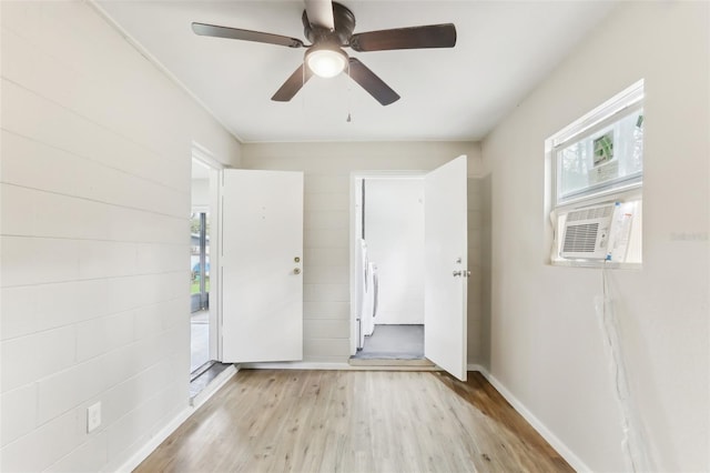 7711 Amherst St Unit A & B, Tampa, FL 33625 - spare room with plenty of natural light, light wood finished floors, washer / clothes dryer, and a ceiling fan
