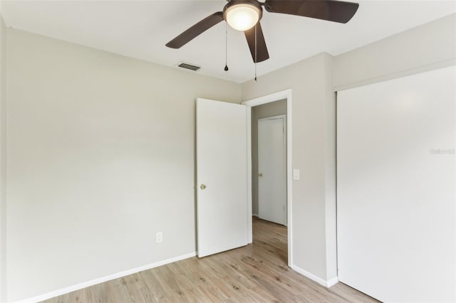 7711 Amherst St Unit A & B, Tampa, FL 33625 - unfurnished bedroom featuring light wood-type flooring, baseboards, a closet, and ceiling fan