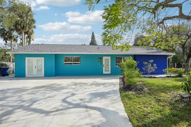 1832 Flamingo Dr, North Fort Myers, FL 33917 - single story home featuring french doors and concrete driveway