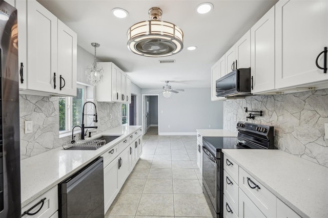 1832 Flamingo Dr, North Fort Myers, FL 33917 - kitchen with light tile patterned floors, a sink, visible vents, a ceiling fan, and black appliances