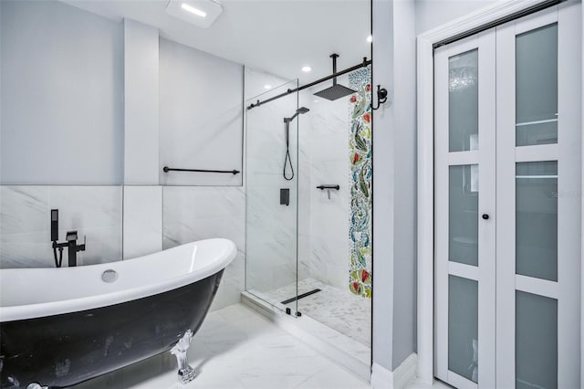 1832 Flamingo Dr, North Fort Myers, FL 33917 - full bathroom featuring marble finish floor, a stall shower, a soaking tub, and recessed lighting