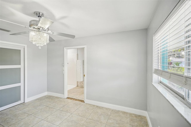 1832 Flamingo Dr, North Fort Myers, FL 33917 - spare room featuring light tile patterned floors, visible vents, baseboards, and ceiling fan