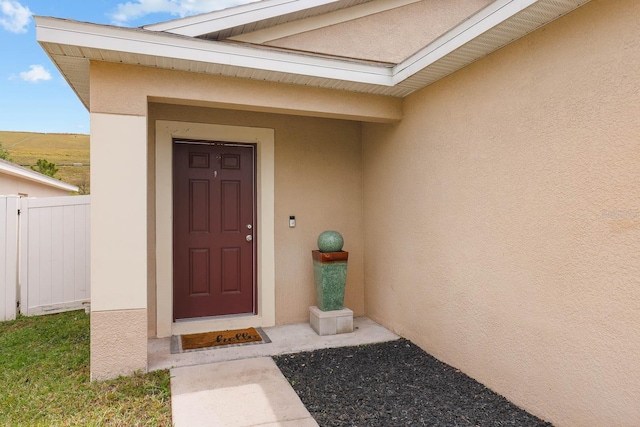 14426 Haddon Mist Dr, Wimauma, FL 33598 - entrance to property featuring stucco siding and fence