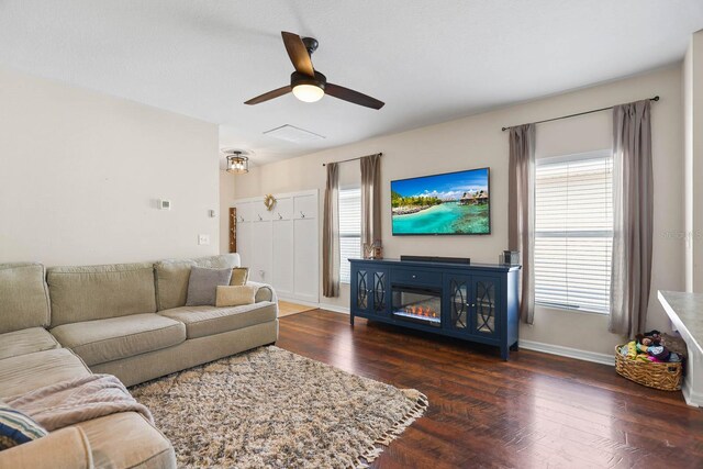 14426 Haddon Mist Dr, Wimauma, FL 33598 - living area featuring a ceiling fan, baseboards, and wood finished floors