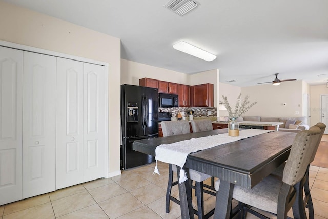 14426 Haddon Mist Dr, Wimauma, FL 33598 - dining area with visible vents, ceiling fan, and light tile patterned floors