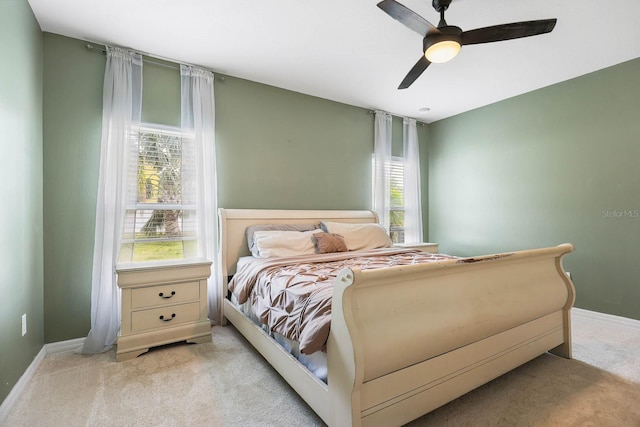 14426 Haddon Mist Dr, Wimauma, FL 33598 - bedroom featuring light colored carpet, ceiling fan, and baseboards
