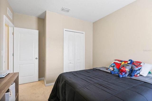 14426 Haddon Mist Dr, Wimauma, FL 33598 - bedroom featuring light carpet, baseboards, a closet, and visible vents