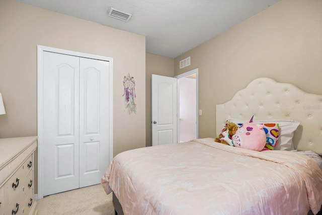 14426 Haddon Mist Dr, Wimauma, FL 33598 - bedroom featuring light carpet, a closet, and visible vents