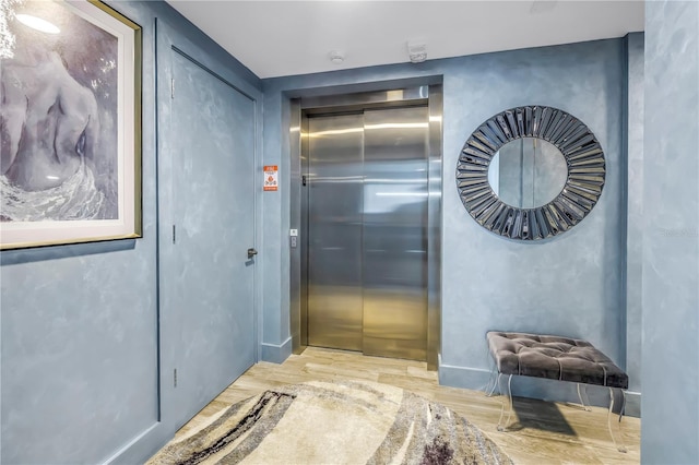 19816 Gulf Blvd Unit 201, Indian Shores, FL 33785 - corridor featuring elevator and wood finished floors