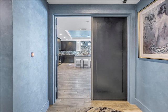 19816 Gulf Blvd Unit 201, Indian Shores, FL 33785 - entryway featuring baseboards and light wood finished floors