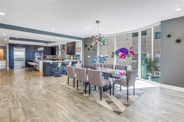 19816 Gulf Blvd Unit 201, Indian Shores, FL 33785 - dining area featuring light wood-style floors, a chandelier, and recessed lighting