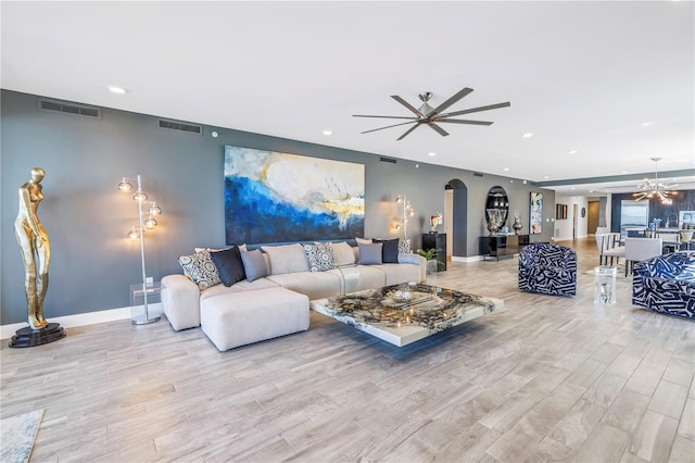 19816 Gulf Blvd Unit 201, Indian Shores, FL 33785 - living area featuring arched walkways, a ceiling fan, visible vents, and recessed lighting