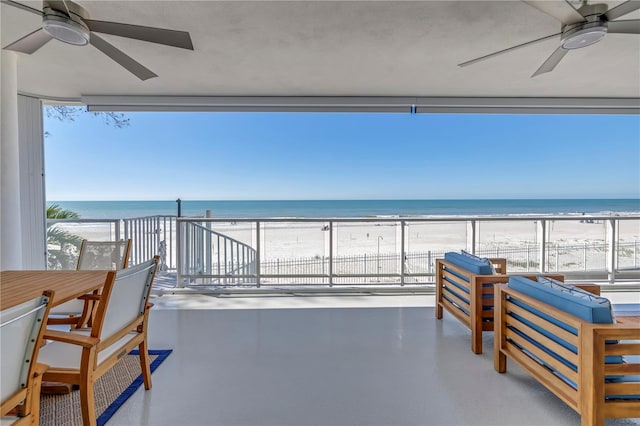 19816 Gulf Blvd Unit 201, Indian Shores, FL 33785 - view of patio with a water view, a balcony, a beach view, and ceiling fan