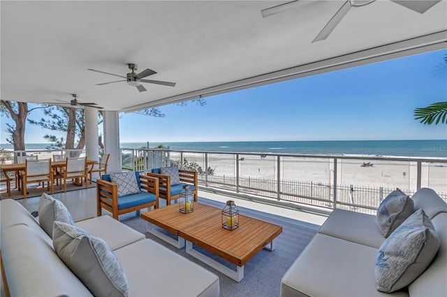 19816 Gulf Blvd Unit 201, Indian Shores, FL 33785 - view of patio / terrace with outdoor lounge area, a water view, ceiling fan, and a view of the beach