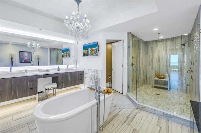 19816 Gulf Blvd Unit 201, Indian Shores, FL 33785 - bathroom with a sink, a freestanding bath, a notable chandelier, and a shower stall