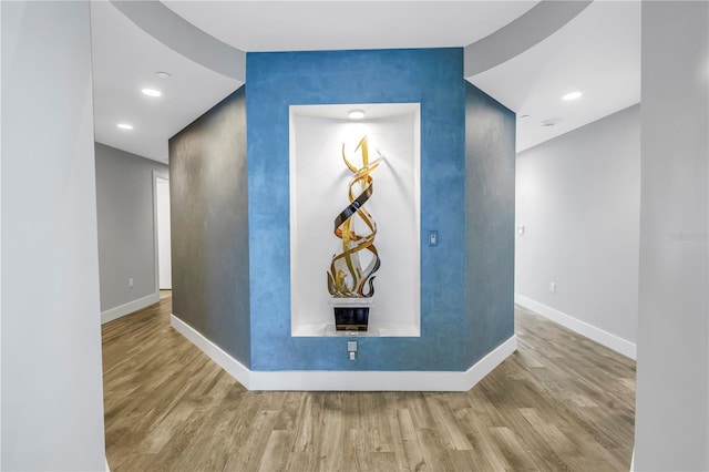 19816 Gulf Blvd Unit 201, Indian Shores, FL 33785 - interior space featuring baseboards, recessed lighting, an accent wall, and wood finished floors