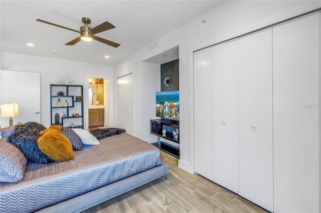 19816 Gulf Blvd Unit 201, Indian Shores, FL 33785 - bedroom with ensuite bathroom, light wood-type flooring, visible vents, and recessed lighting