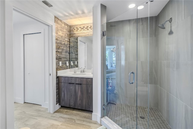 19816 Gulf Blvd Unit 201, Indian Shores, FL 33785 - bathroom with a stall shower, vanity, and visible vents