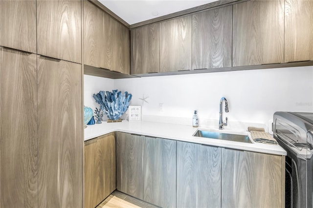 19816 Gulf Blvd Unit 201, Indian Shores, FL 33785 - laundry area featuring washer / clothes dryer, a sink, and cabinet space