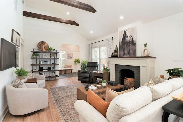 2910 W Aquilla St, Tampa, FL 33629 - living area with beamed ceiling, a brick fireplace, wood finished floors, recessed lighting, and high vaulted ceiling
