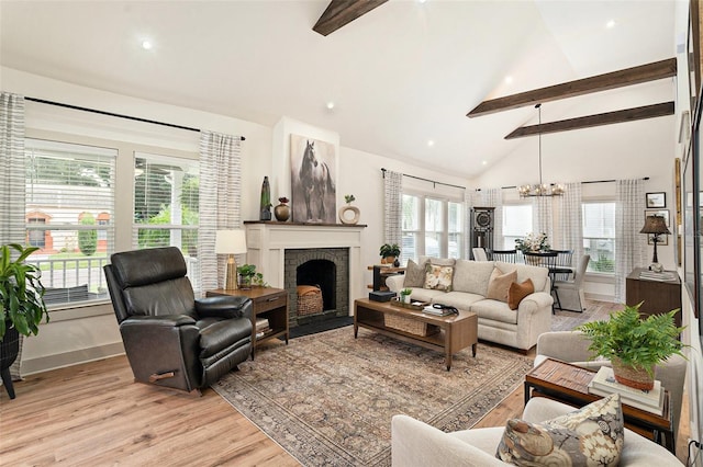 2910 W Aquilla St, Tampa, FL 33629 - living area with beamed ceiling, baseboards, light wood finished floors, high vaulted ceiling, and a chandelier