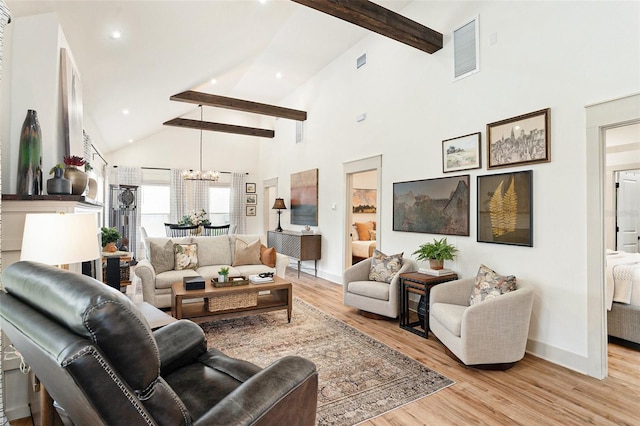 2910 W Aquilla St, Tampa, FL 33629 - living room with a chandelier, beam ceiling, light wood finished floors, baseboards, and high vaulted ceiling