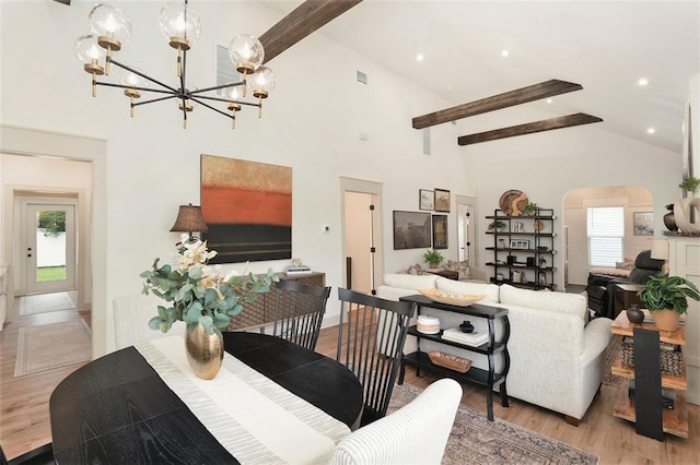 2910 W Aquilla St, Tampa, FL 33629 - dining area with high vaulted ceiling, beam ceiling, a chandelier, light wood-style floors, and arched walkways