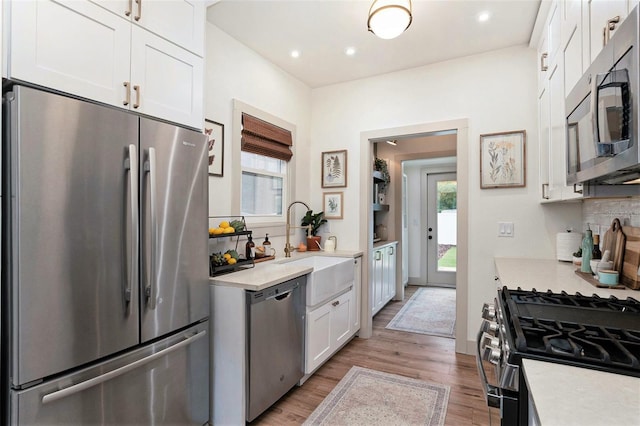 2910 W Aquilla St, Tampa, FL 33629 - kitchen with stainless steel appliances, light countertops, white cabinetry, and recessed lighting