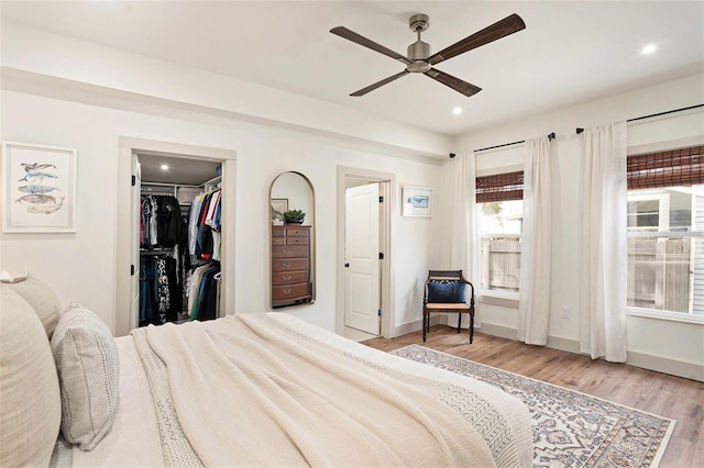 2910 W Aquilla St, Tampa, FL 33629 - bedroom featuring light wood-style flooring, baseboards, recessed lighting, a ceiling fan, and a spacious closet