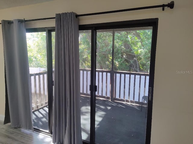 doorway to outside featuring wood finished floors
