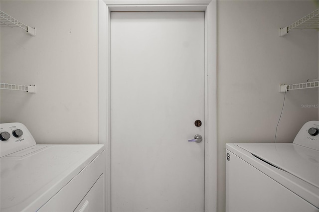 washroom featuring laundry area and independent washer and dryer