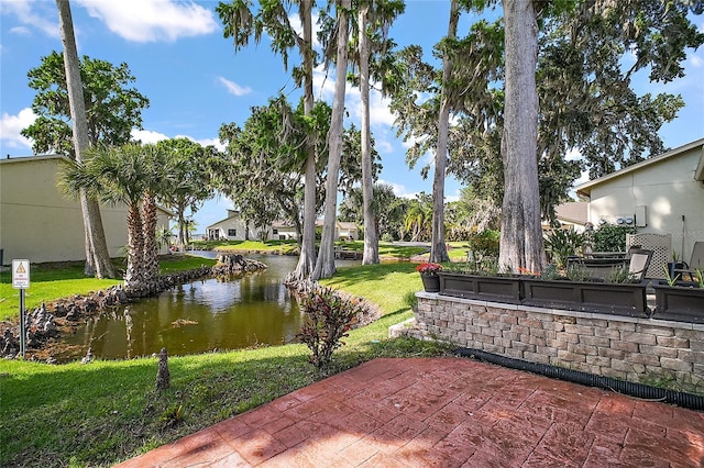 view of patio with a water view