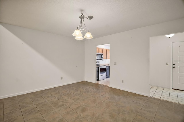 interior space with an inviting chandelier, light tile patterned floors, and baseboards