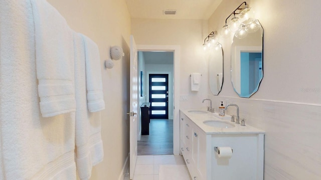 4530 5th Ave S, Saint Petersburg, FL 33711 - bathroom with tile patterned floors and double vanity