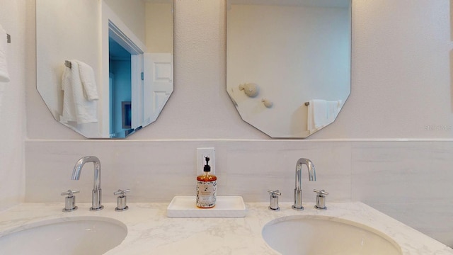 4530 5th Ave S, Saint Petersburg, FL 33711 - bathroom featuring double vanity and backsplash