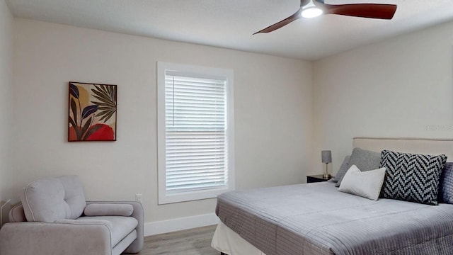 4530 5th Ave S, Saint Petersburg, FL 33711 - bedroom featuring light wood-style floors, baseboards, and ceiling fan