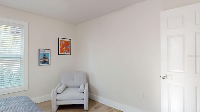 4530 5th Ave S, Saint Petersburg, FL 33711 - sitting room featuring baseboards, healthy amount of natural light, and light wood-style floors