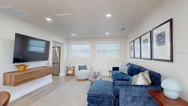 4530 5th Ave S, Saint Petersburg, FL 33711 - living area featuring light wood-style flooring, recessed lighting, baseboards, and attic access