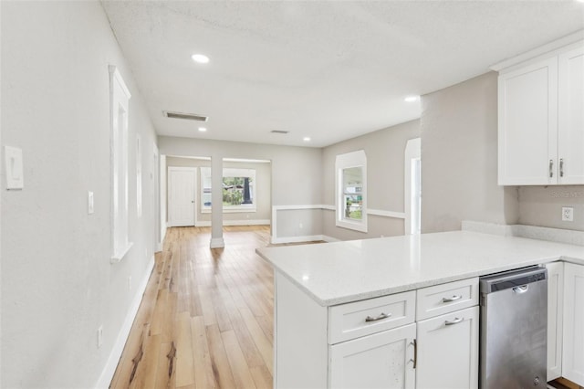 2920 E 20th Ave, Tampa, FL 33605 - kitchen with light wood finished floors, white cabinetry, visible vents, and dishwasher