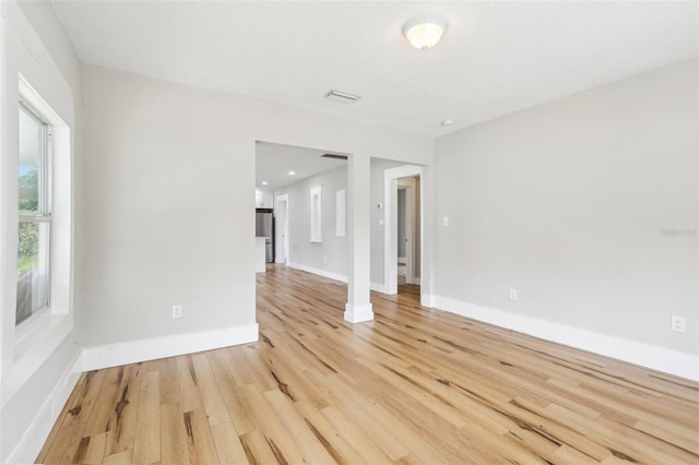 2920 E 20th Ave, Tampa, FL 33605 - spare room featuring baseboards and light wood-type flooring