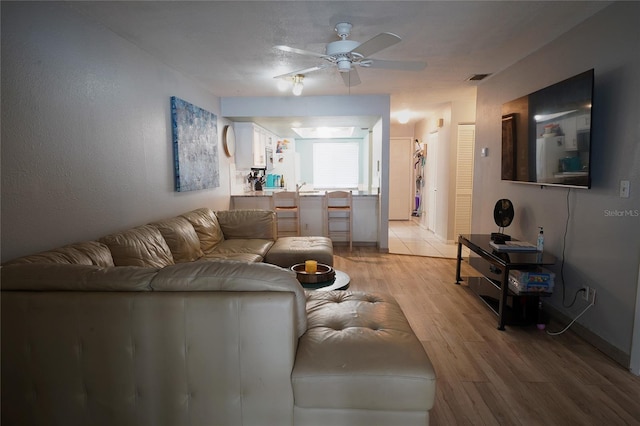7360 Ulmerton Rd Unit 29B, Largo, FL 33771 - living area with a ceiling fan and light wood-style flooring
