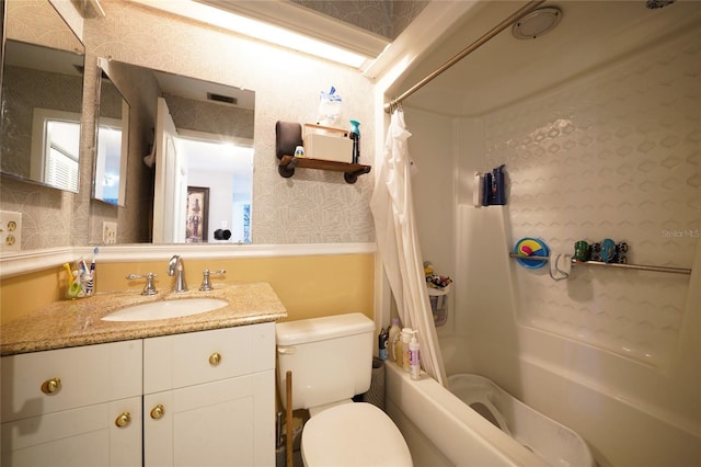 7360 Ulmerton Rd Unit 29B, Largo, FL 33771 - full bathroom with wallpapered walls, vanity, shower / bath combo with shower curtain, and a wainscoted wall