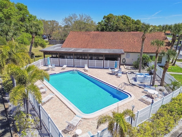 7360 Ulmerton Rd Unit 29B, Largo, FL 33771 - community pool featuring a patio area and view of wooded area